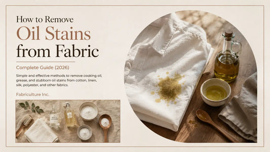 Editorial image of an oil-stained white cotton shirt with cooking oil, dish soap, baking soda, and stain removal supplies on a wooden table.